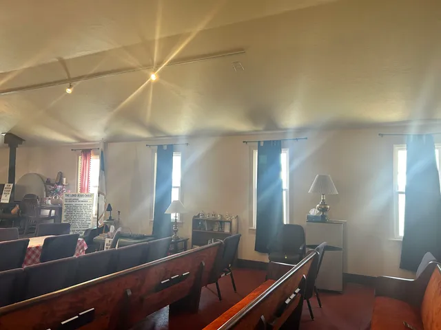 a view of a lobby area with furniture and wooden floor