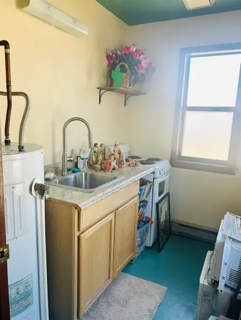 a utility room with a sink dryer and washer