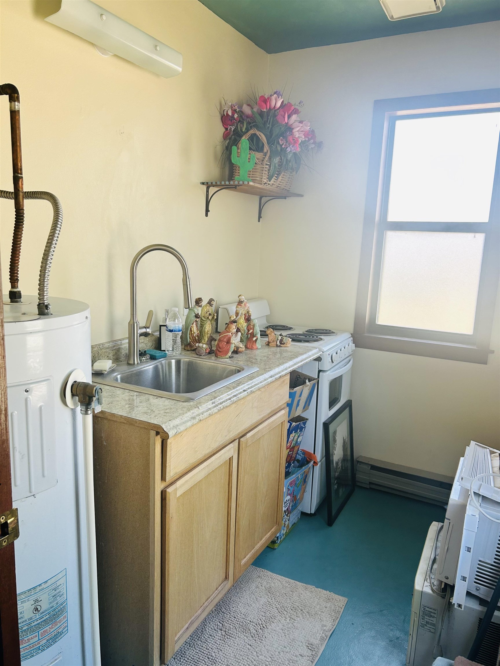 49067 KE Road Mesa, CO 81643 - Photo 31 of 31 a utility room with a sink dryer and washer