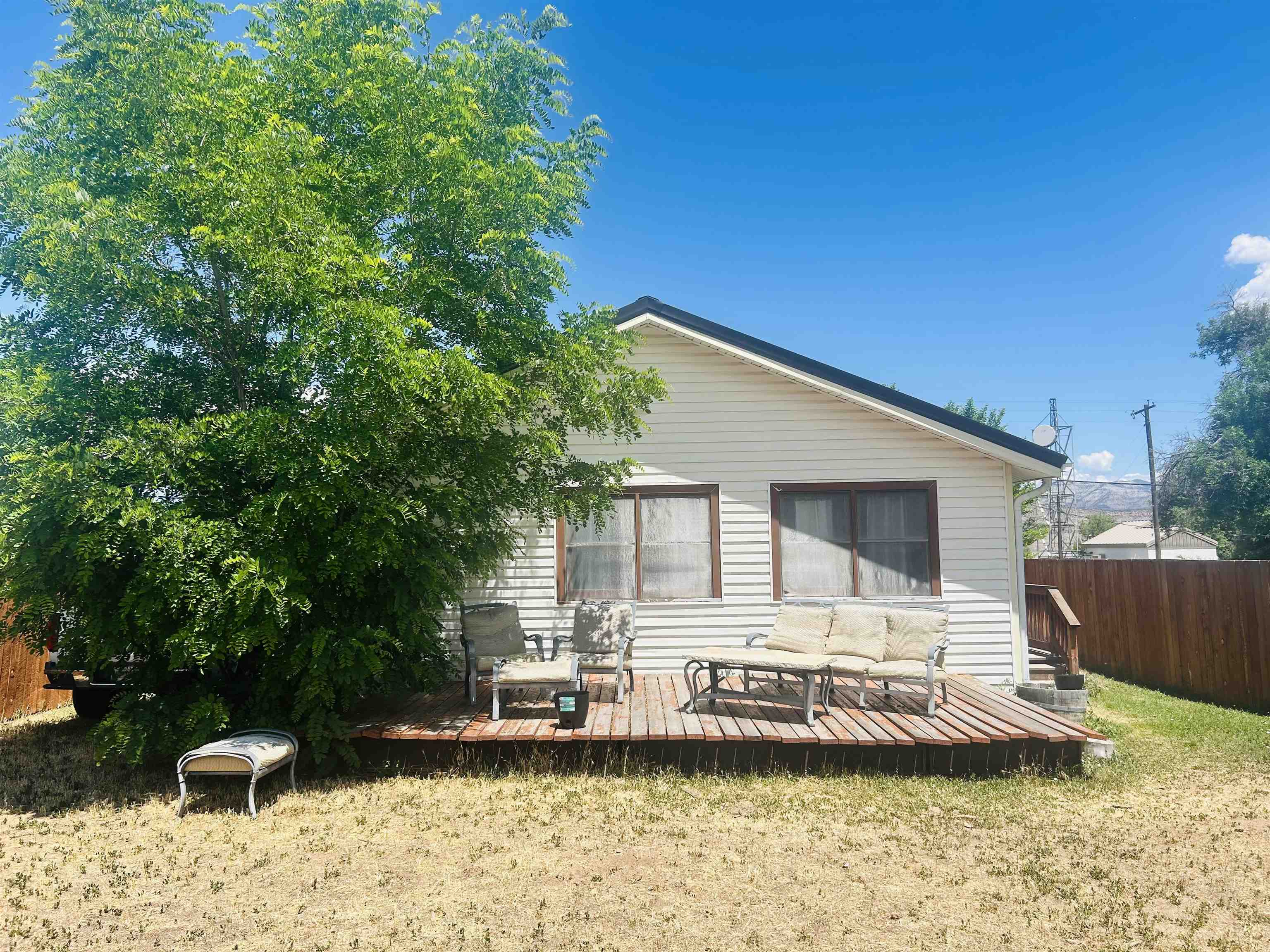 49067 KE Road Mesa, CO 81643 - Photo 6 of 31 a view of a house with a yard