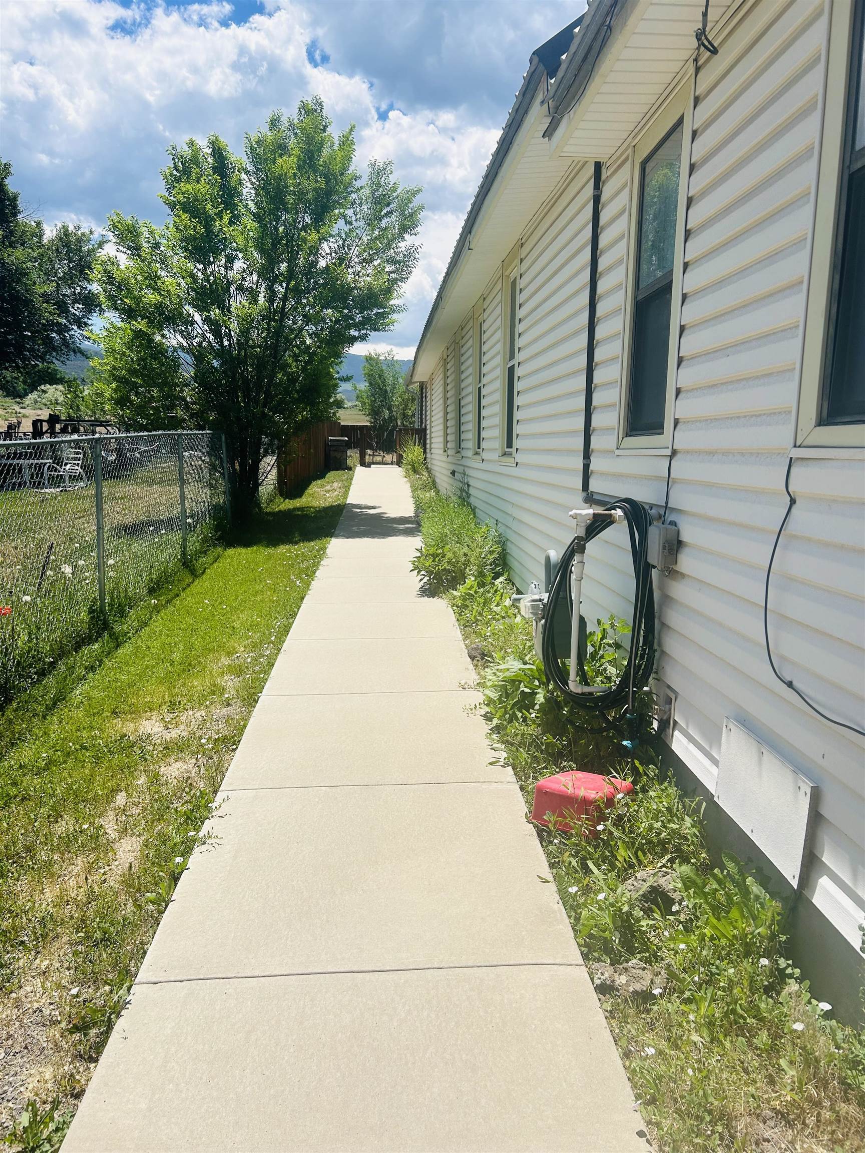 49067 KE Road Mesa, CO 81643 - Photo 7 of 31 a front view of a house with garden