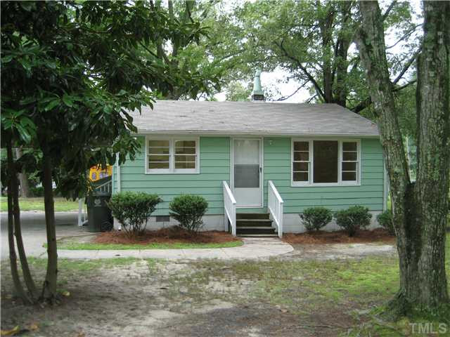 1218 Platinum Avenue Raleigh, NC 27610 - Photo 12 of 13 a view of a house with backyard sitting area and garden