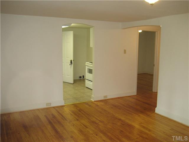 1218 Platinum Avenue Raleigh, NC 27610 - Photo 4 of 13 wooden floor in an empty room