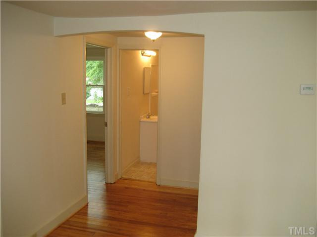 1218 Platinum Avenue Raleigh, NC 27610 - Photo 8 of 13 a view of a bathroom with wooden floor