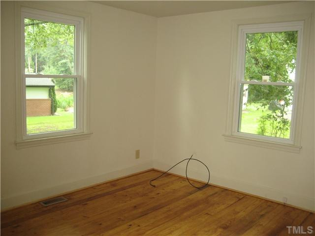 1218 Platinum Avenue Raleigh, NC 27610 - Photo 10 of 13 a room with a window