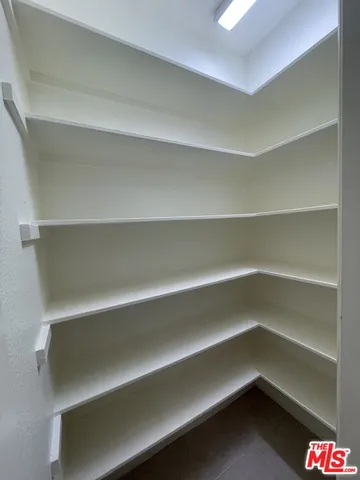 a storage room with a wooden floor