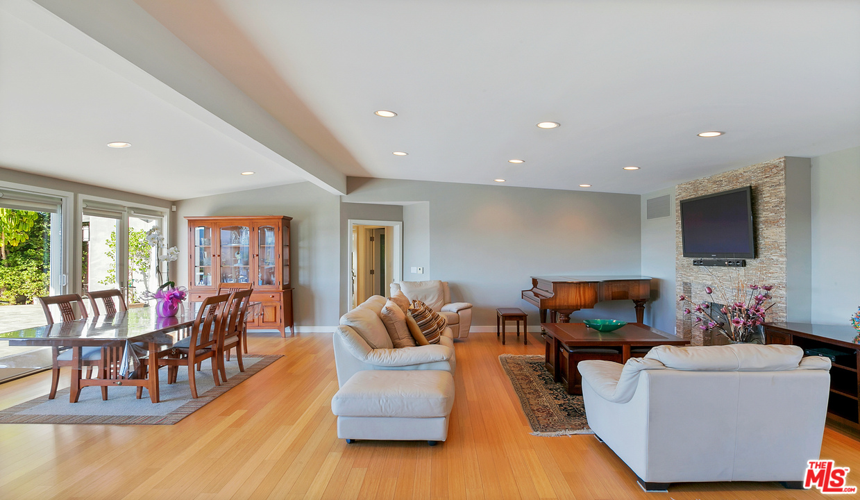 3921 Cody Road Sherman Oaks, CA 91403 - Photo 6 of 36 a living room with furniture and a flat screen tv