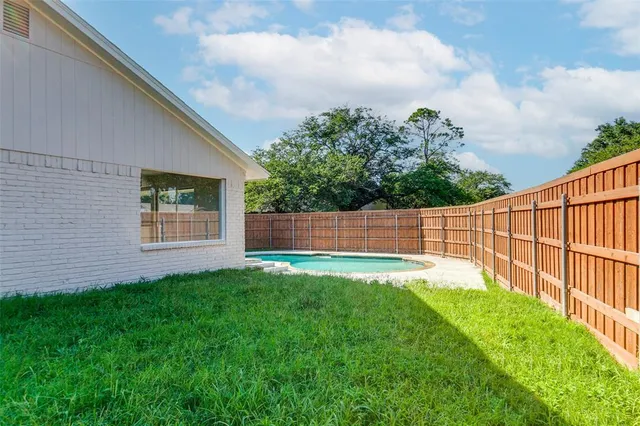 a front view of house with garden