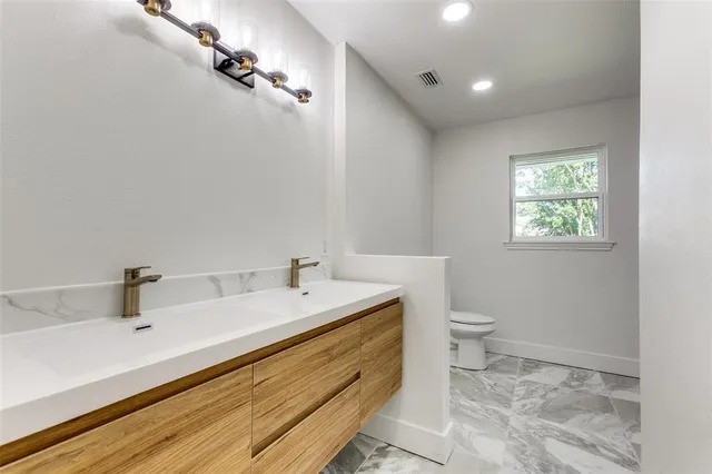 a bathroom with a sink and a toilet