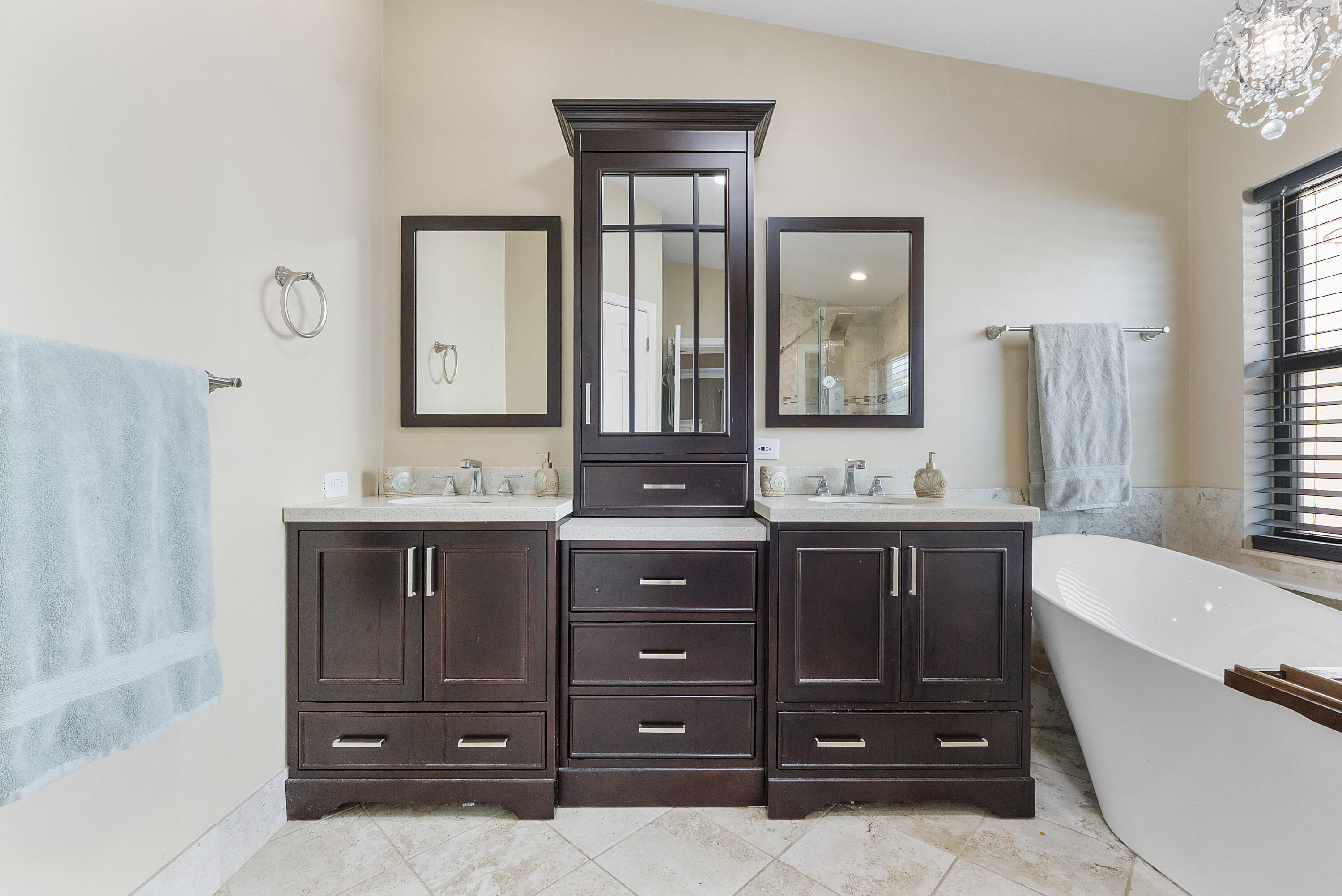 12328 St Simon Drive Boca Raton, FL 33428 - Photo 22 of 52 a bathroom with a granite countertop double vanity sink a mirror and a bathtub