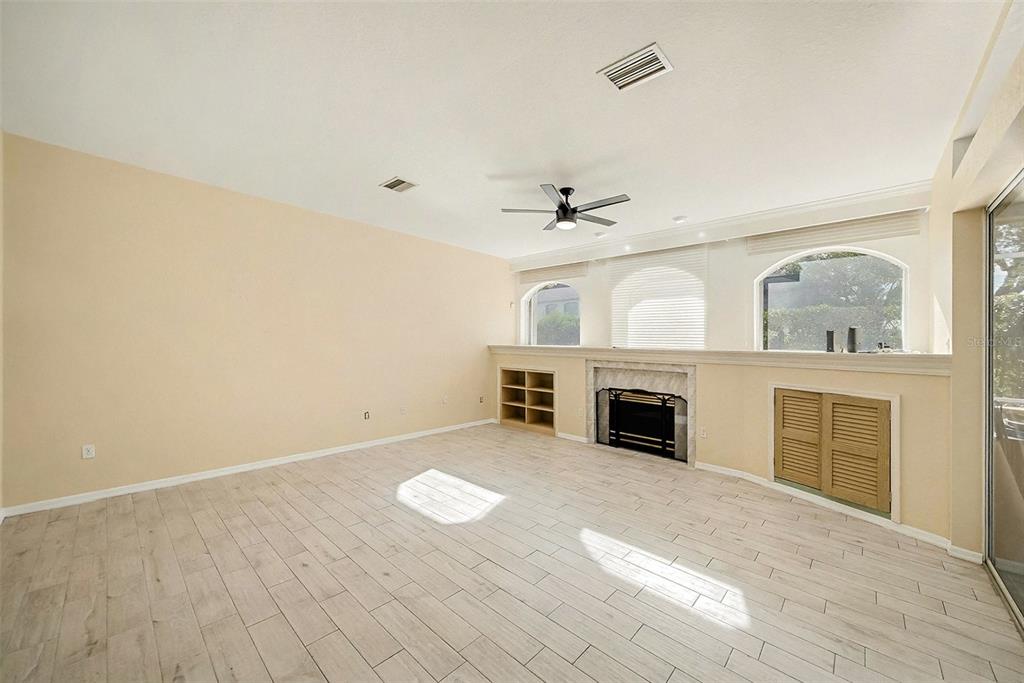 8402 Maybelle Drive Weeki Wachee, FL 34613 - Photo 16 of 41 a view of a livingroom with a fireplace