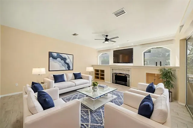 a living room with furniture and a fireplace