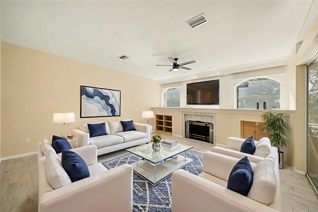 8402 Maybelle Drive Weeki Wachee, FL 34613 - Photo 17 of 41 a living room with furniture and a fireplace