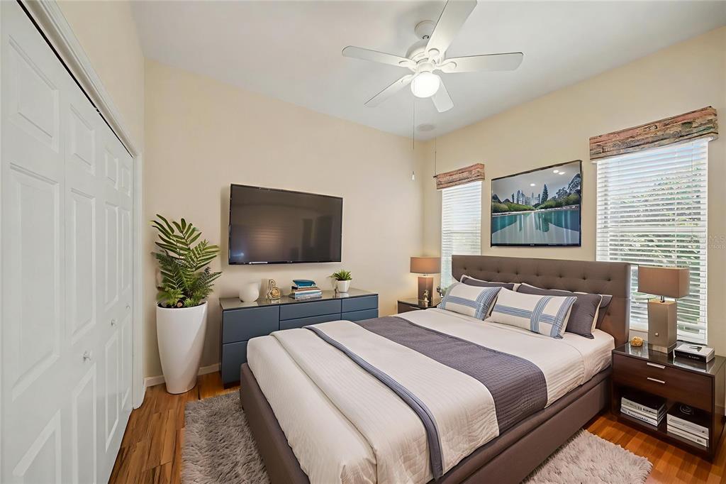 8402 Maybelle Drive Weeki Wachee, FL 34613 - Photo 21 of 41 a bedroom with a bed and a flat screen tv