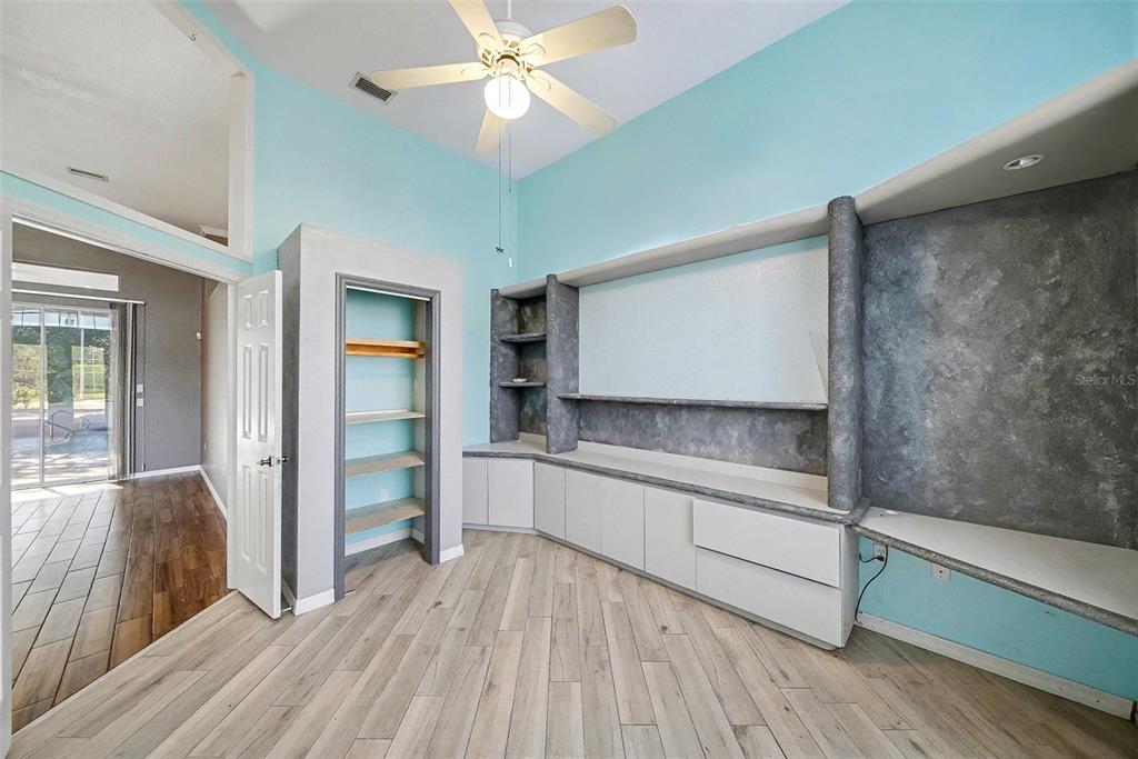 8402 Maybelle Drive Weeki Wachee, FL 34613 - Photo 24 of 41 a kitchen with stainless steel appliances a sink and wooden floor