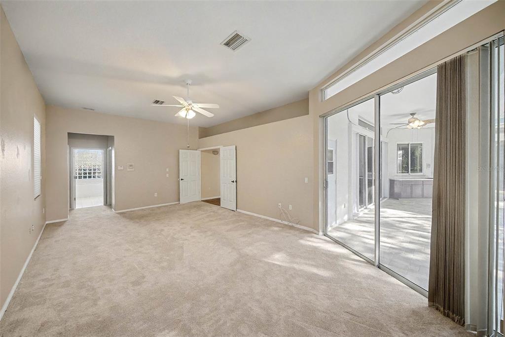 8402 Maybelle Drive Weeki Wachee, FL 34613 - Photo 27 of 41 wooden floor and windows in an empty room