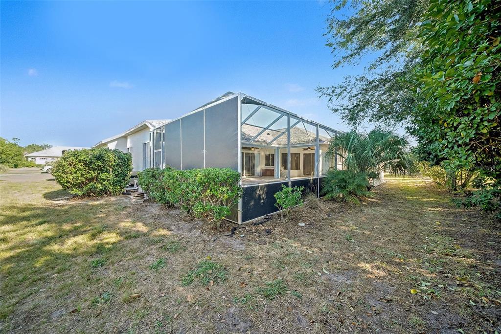 8402 Maybelle Drive Weeki Wachee, FL 34613 - Photo 36 of 41 a front view of a house with garden