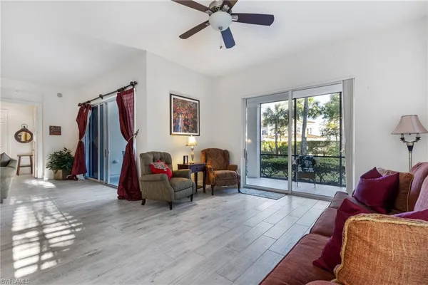 a living room with furniture and a window
