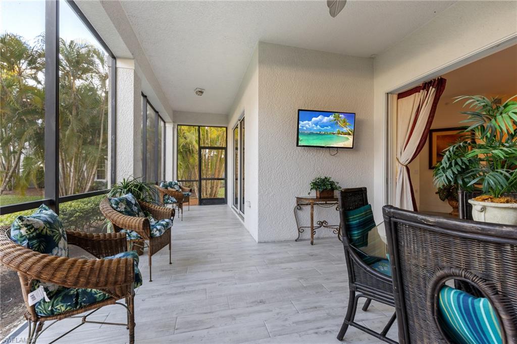 9079 Cascada Way, Unit 102 Naples, FL 34114 - Photo 22 of 49 a living room with furniture and a potted plant