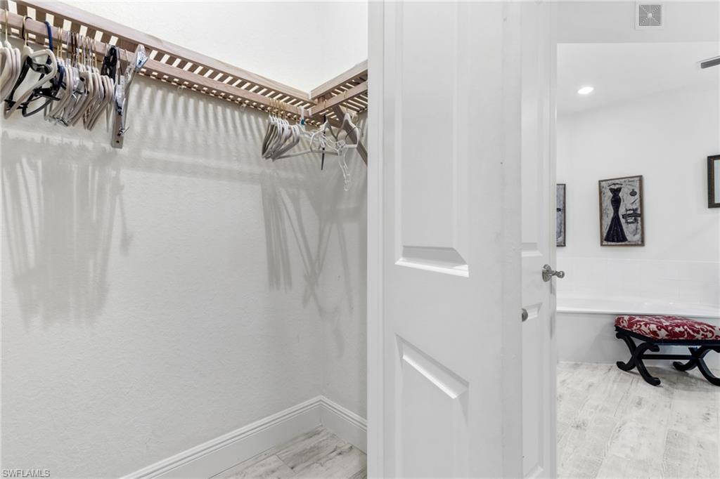 9079 Cascada Way, Unit 102 Naples, FL 34114 - Photo 27 of 49 a view of walk in closet