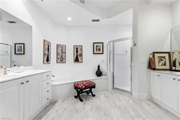 a bedroom with a bed and a bathroom