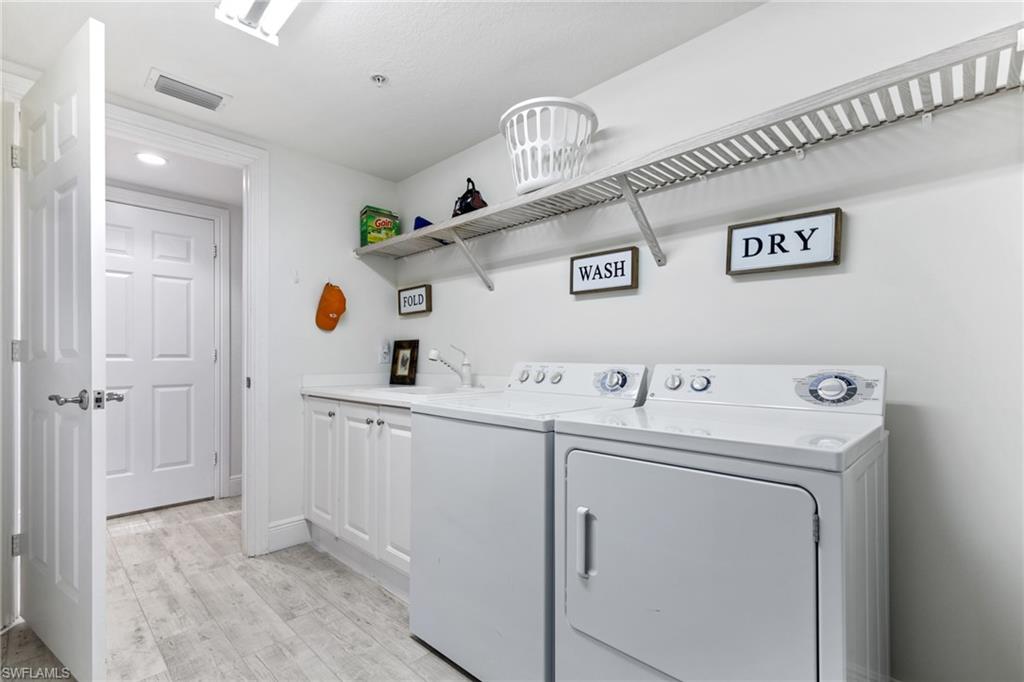 9079 Cascada Way, Unit 102 Naples, FL 34114 - Photo 38 of 49 a view of utility room with washer and dryer