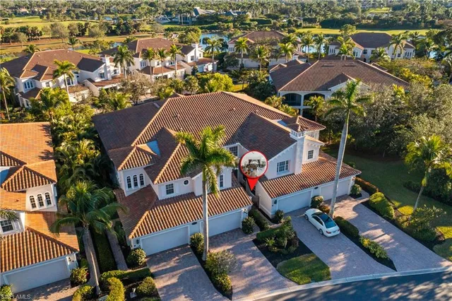 an aerial view of a house with a garden