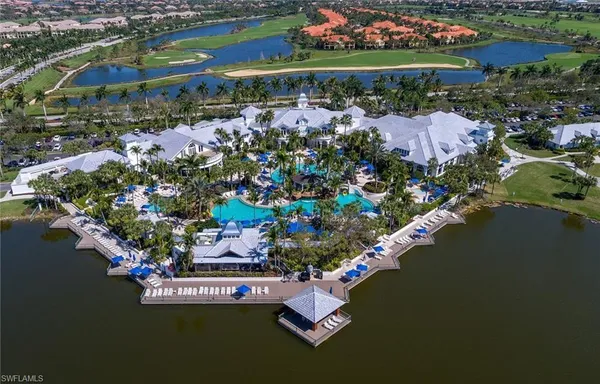 an aerial view of a house with a lake view