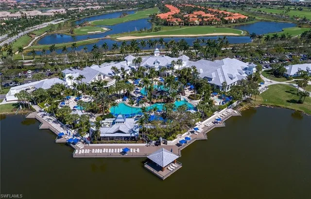 an aerial view of a house with a lake view
