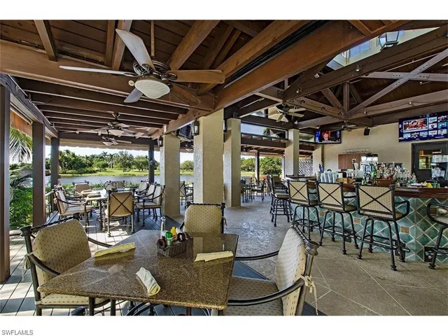 a view of a patio with table and chairs
