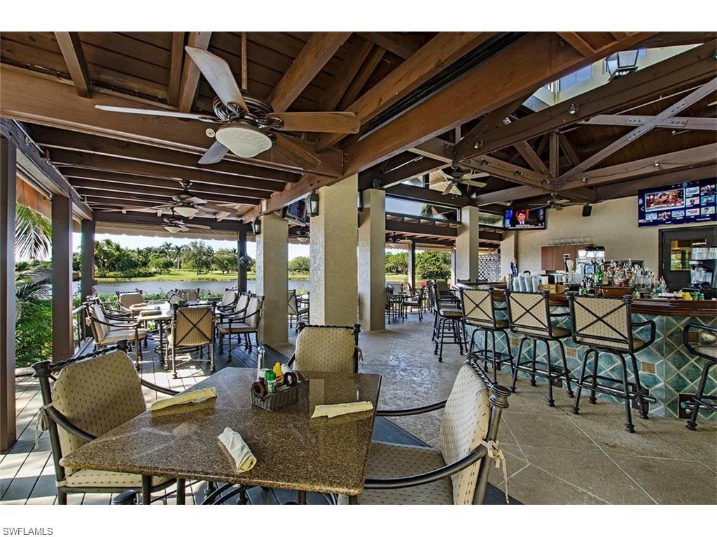 9079 Cascada Way, Unit 102 Naples, FL 34114 - Photo 46 of 49 a view of a patio with table and chairs