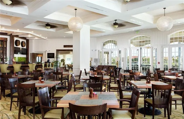 a front view of a house with garden and patio