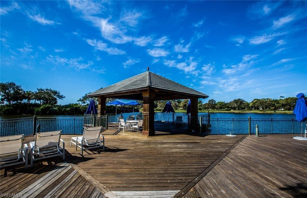 9079 Cascada Way, Unit 102 Naples, FL 34114 - Photo 49 of 49 a front view of a house with garden and patio