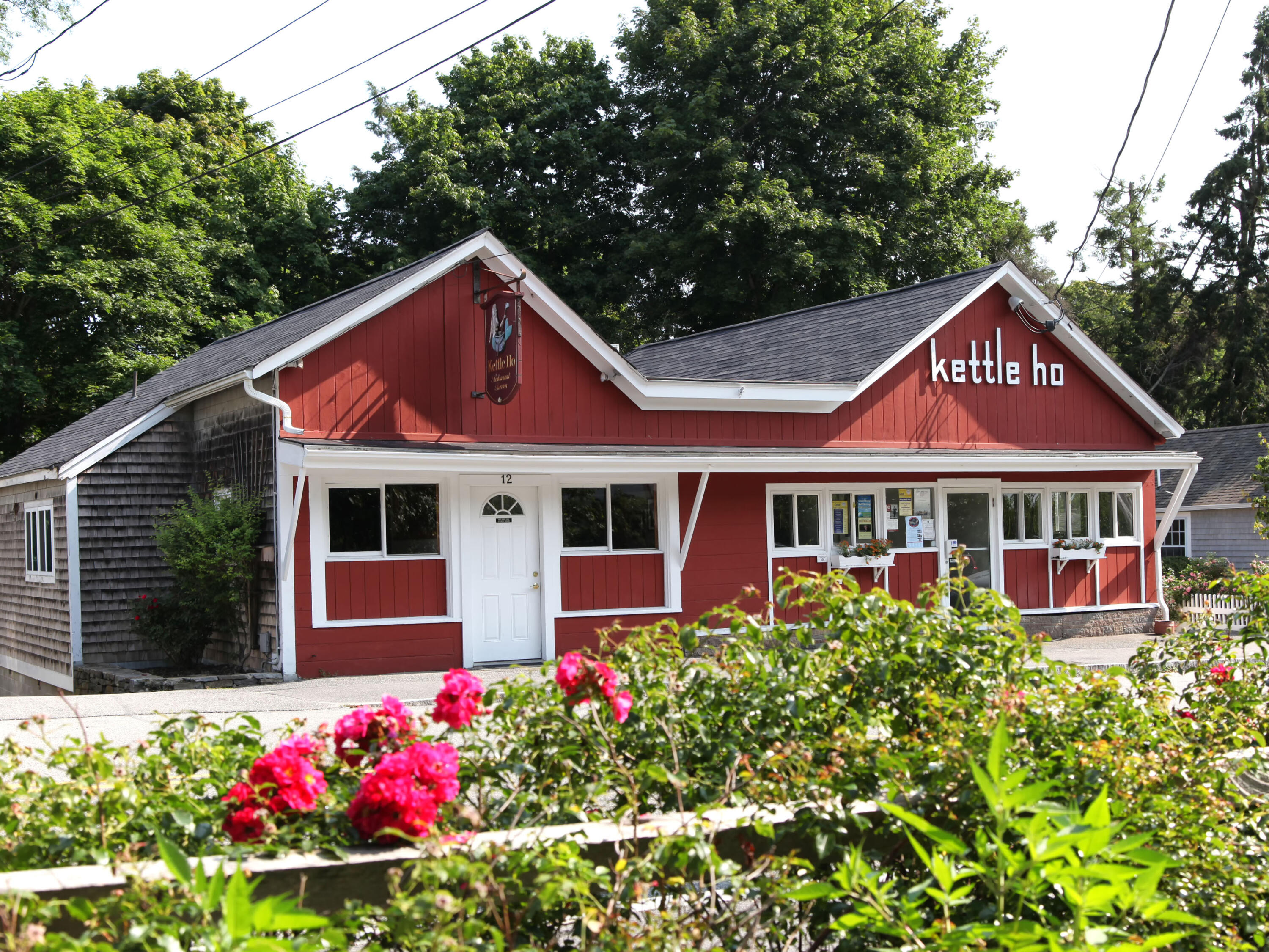 15 Geraldine Road Cotuit, MA 02635 - Photo 22 of 27 a front view of a house with a yard and fountain