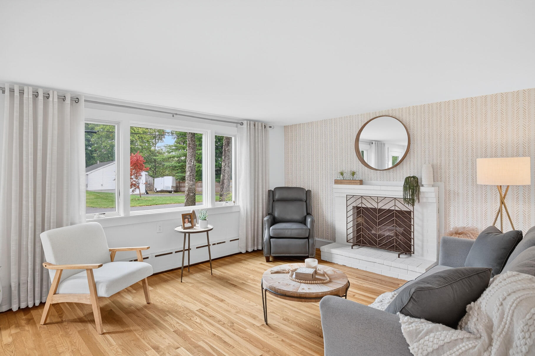 15 Geraldine Road Cotuit, MA 02635 - Photo 4 of 27 a living room with furniture and a fireplace