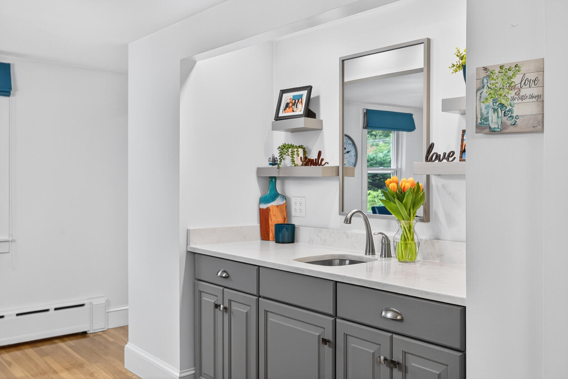 15 Geraldine Road Cotuit, MA 02635 - Photo 6 of 27 a kitchen with a sink cabinets and a potted plant
