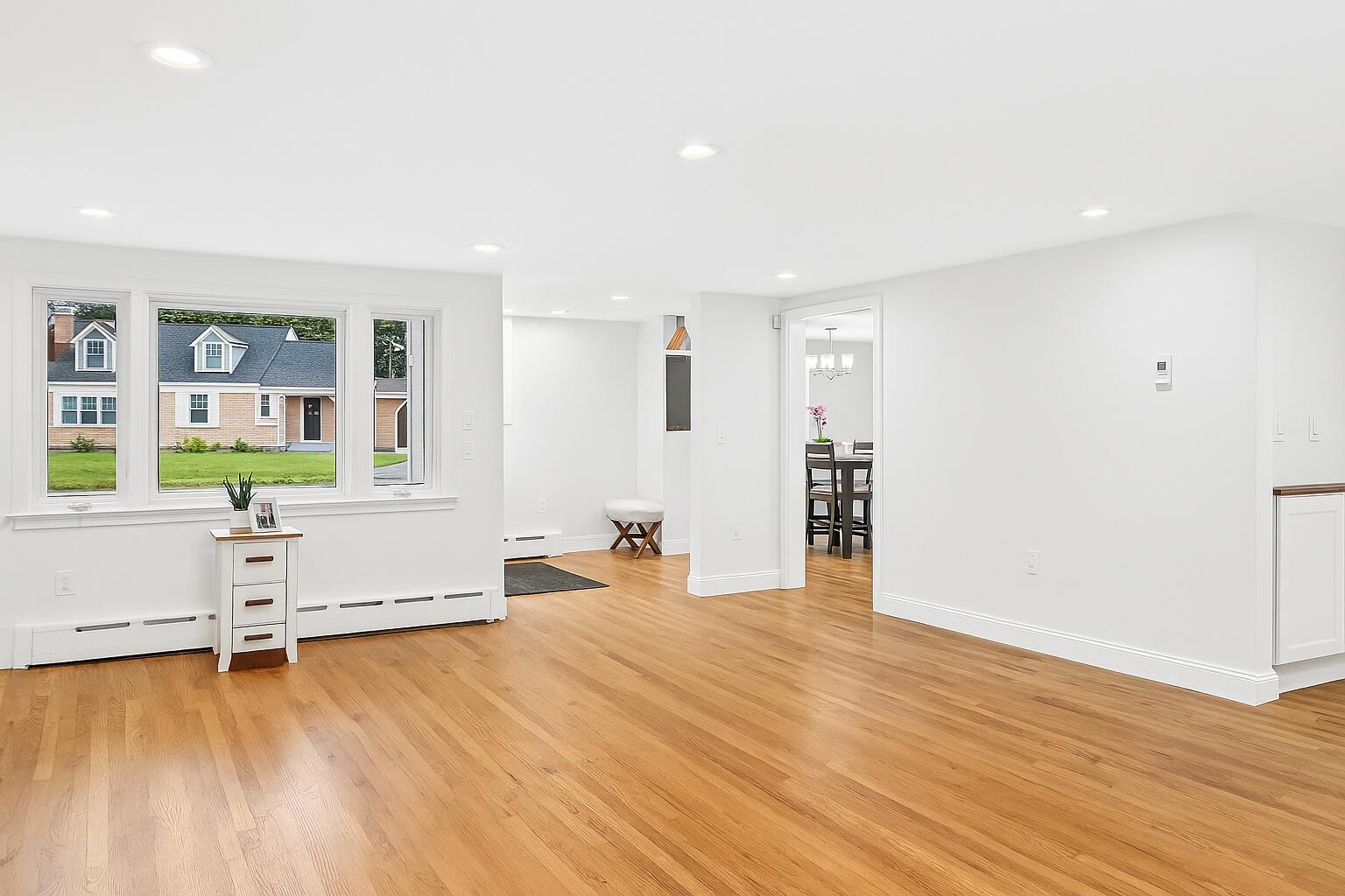 15 Geraldine Road Cotuit, MA 02635 - Photo 9 of 27 a view of an empty room with window and wooden floor