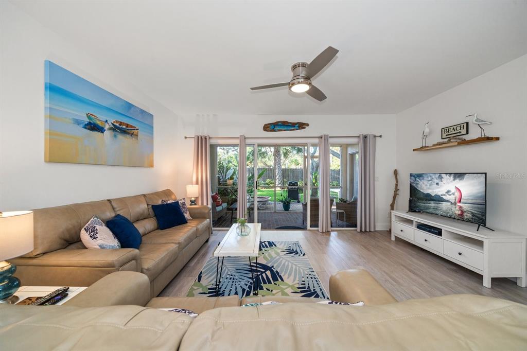 11300 Harbor Way, Unit 1734 Largo, FL 33774 - Photo 12 of 44 a living room with furniture and a flat screen tv