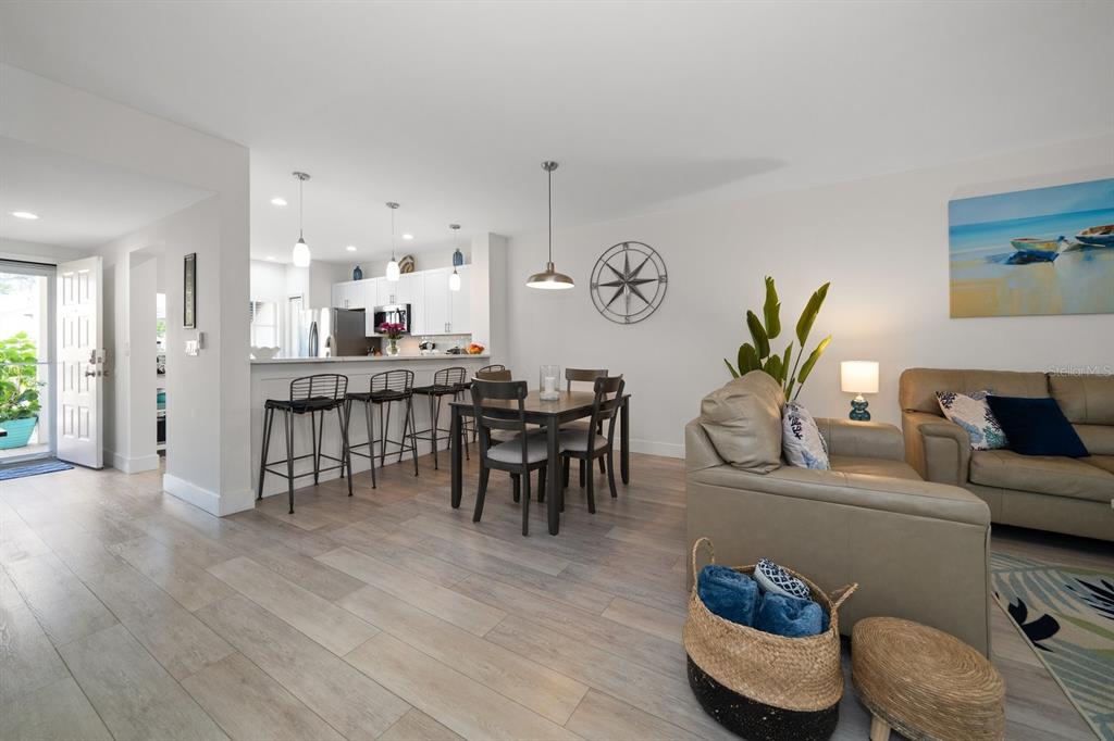 11300 Harbor Way, Unit 1734 Largo, FL 33774 - Photo 13 of 44 a living room with furniture and wooden floor