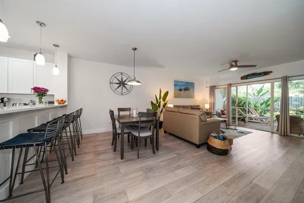 a view of a dining room with furniture window and wooden floor
