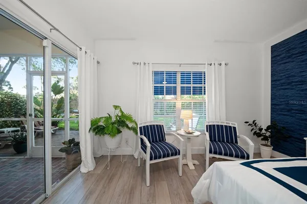 a view of a livingroom with furniture and a potted plant