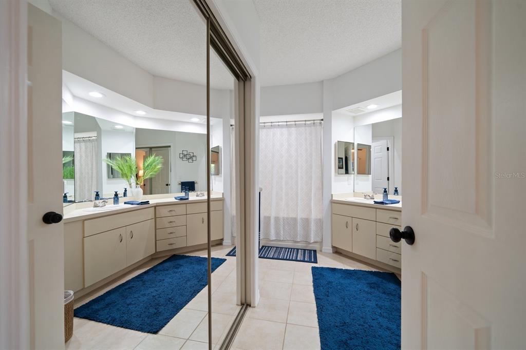 11300 Harbor Way, Unit 1734 Largo, FL 33774 - Photo 20 of 44 a kitchen with sink cabinets and wooden floor