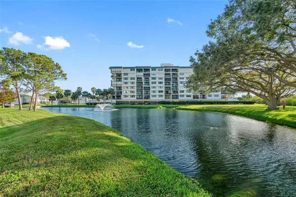 a view of a lake with a building in the background