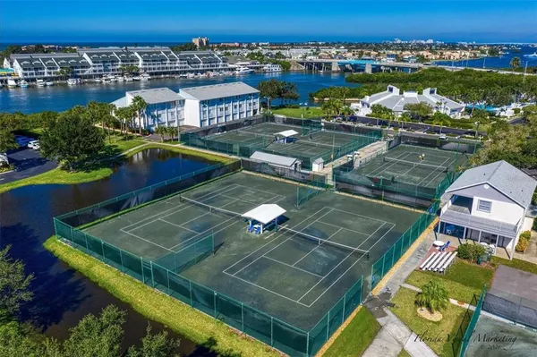 an aerial view of a tennis ground and a balcony