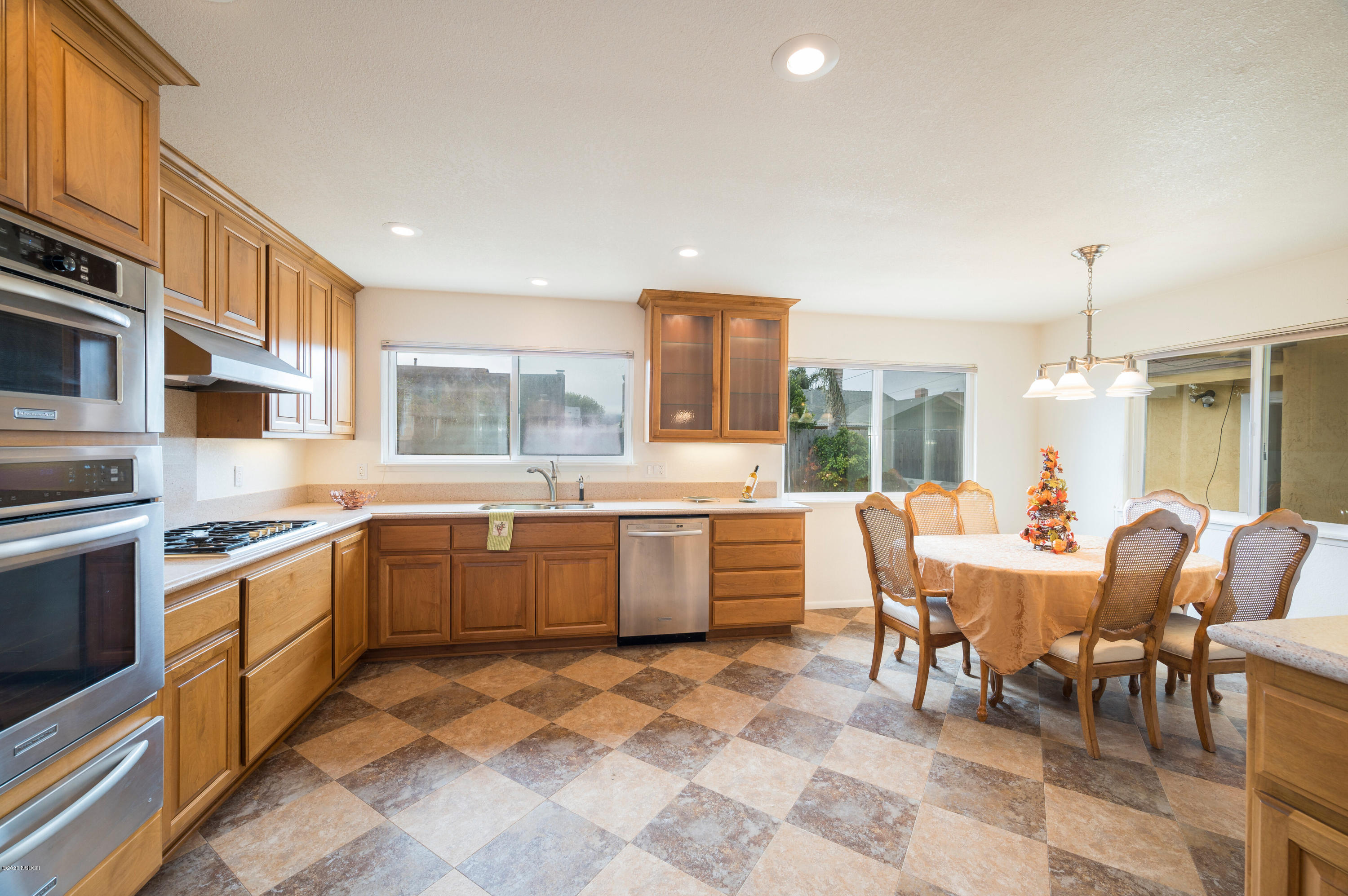 1008 West Anthony Way Lompoc, CA 93436 - Photo 11 of 26 a large kitchen with a table and chairs
