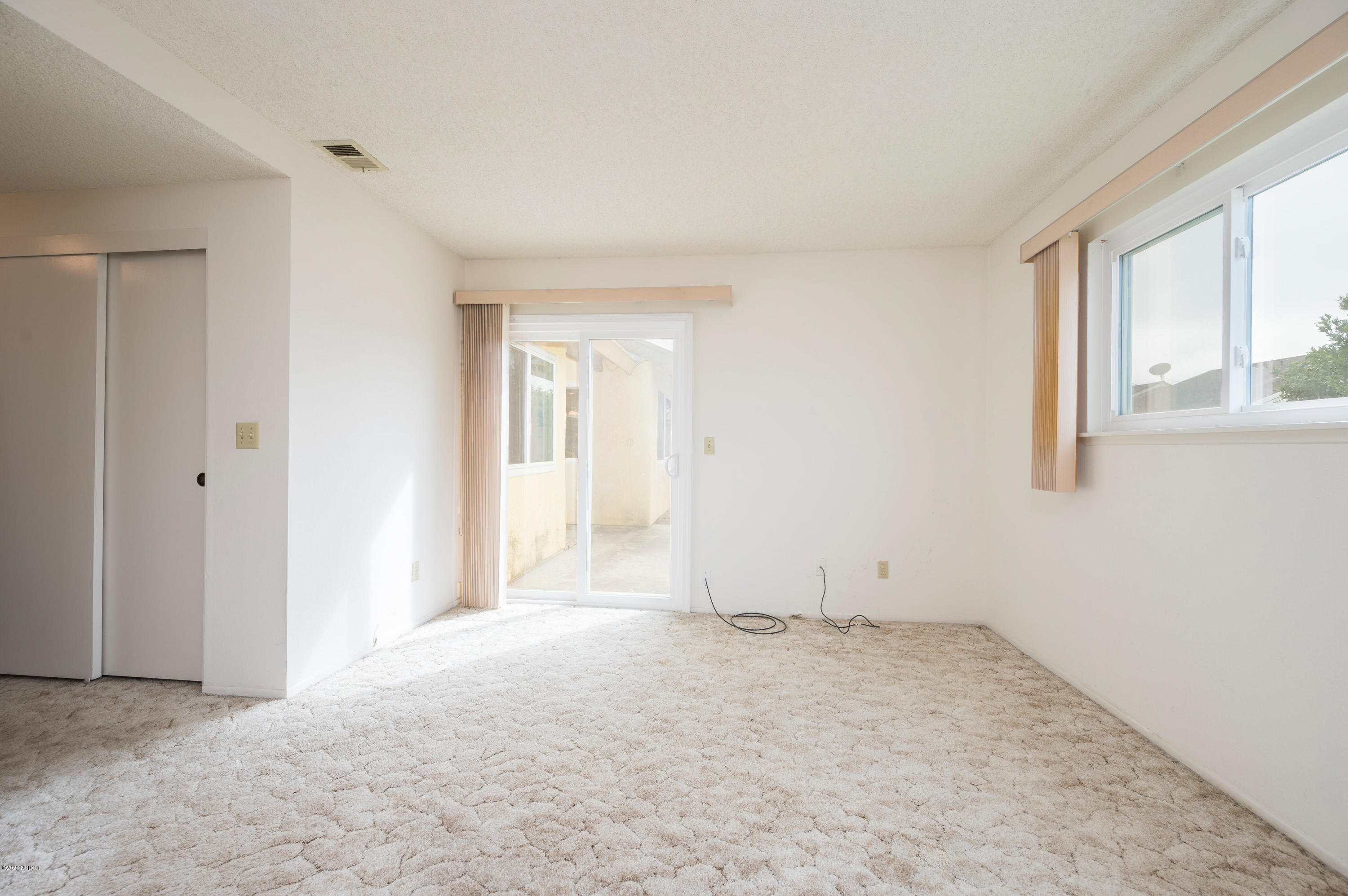 1008 West Anthony Way Lompoc, CA 93436 - Photo 13 of 26 a view of an empty room with a window