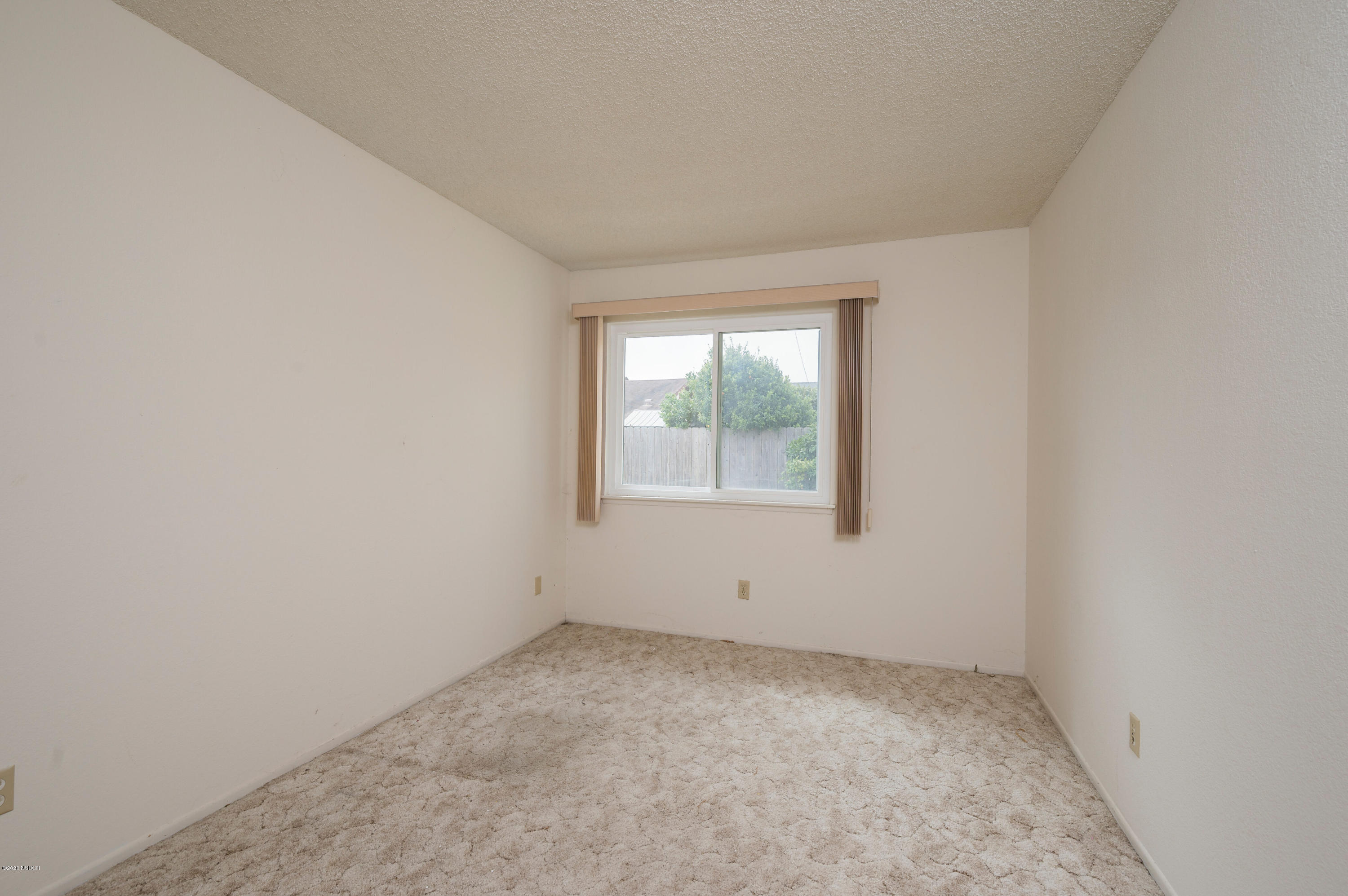 1008 West Anthony Way Lompoc, CA 93436 - Photo 17 of 26 an empty room with a window