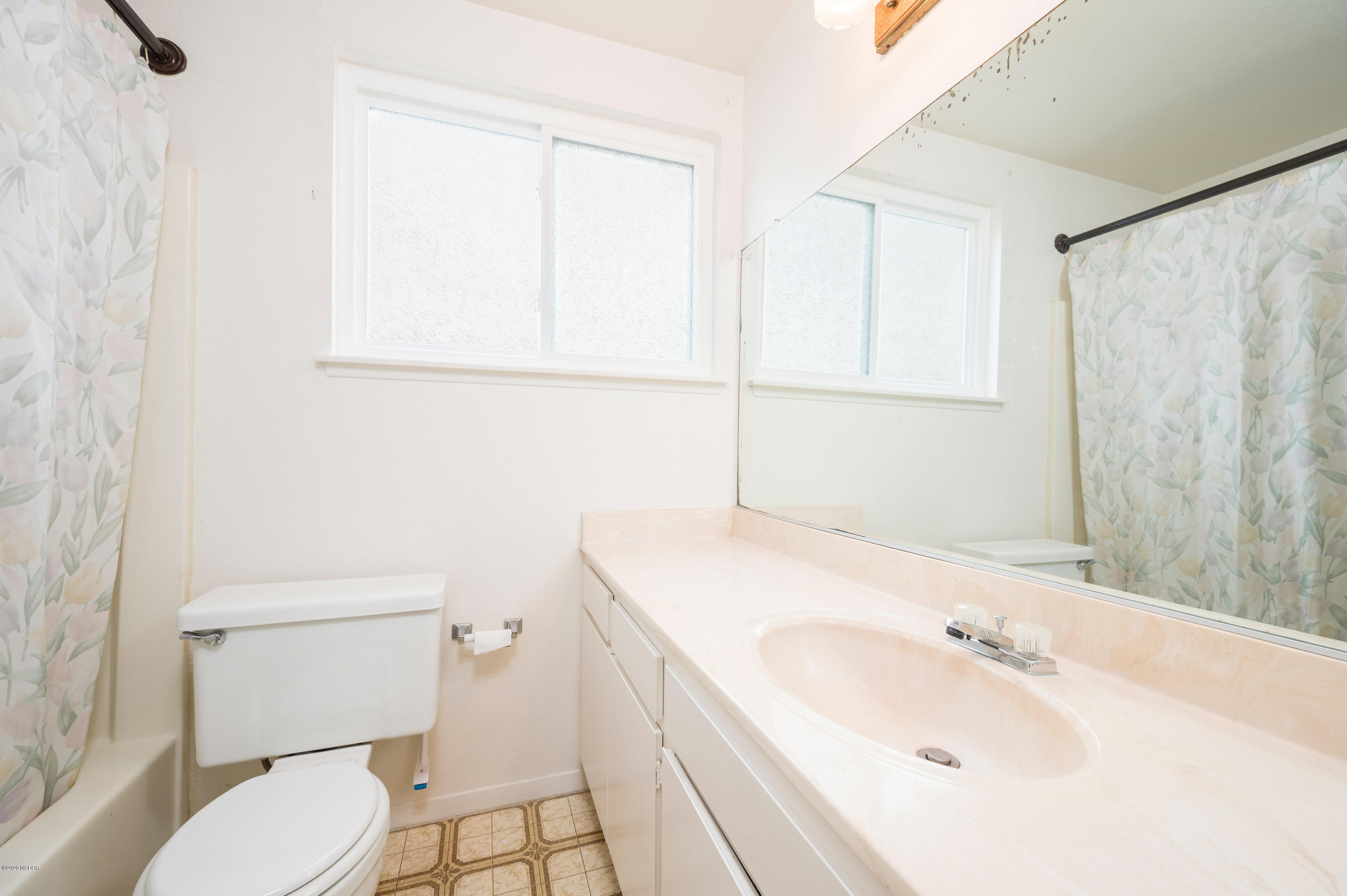 1008 West Anthony Way Lompoc, CA 93436 - Photo 18 of 26 a bathroom with a sink toilet and vanity