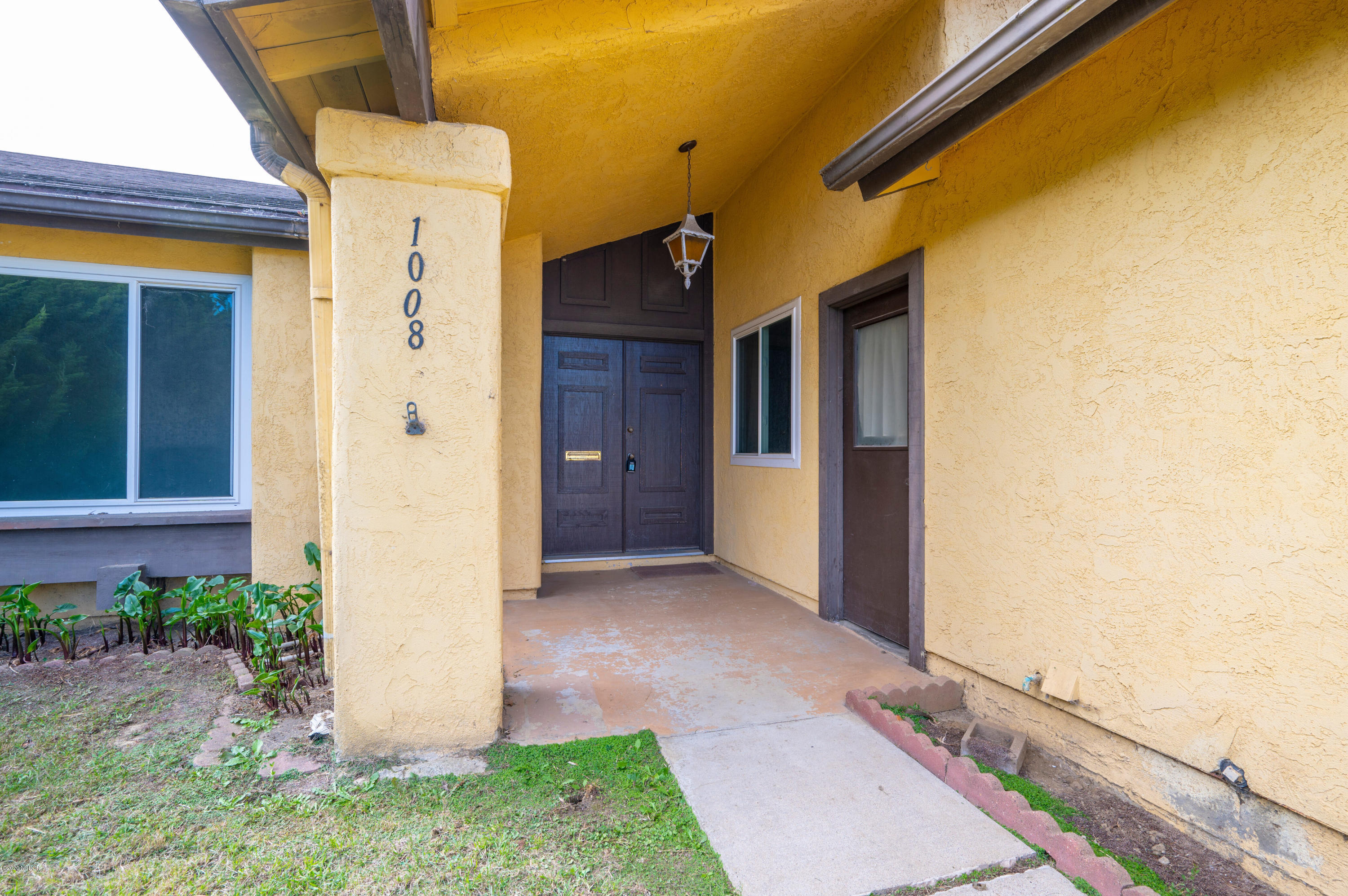 1008 West Anthony Way Lompoc, CA 93436 - Photo 2 of 26 a front view of a house with a yard