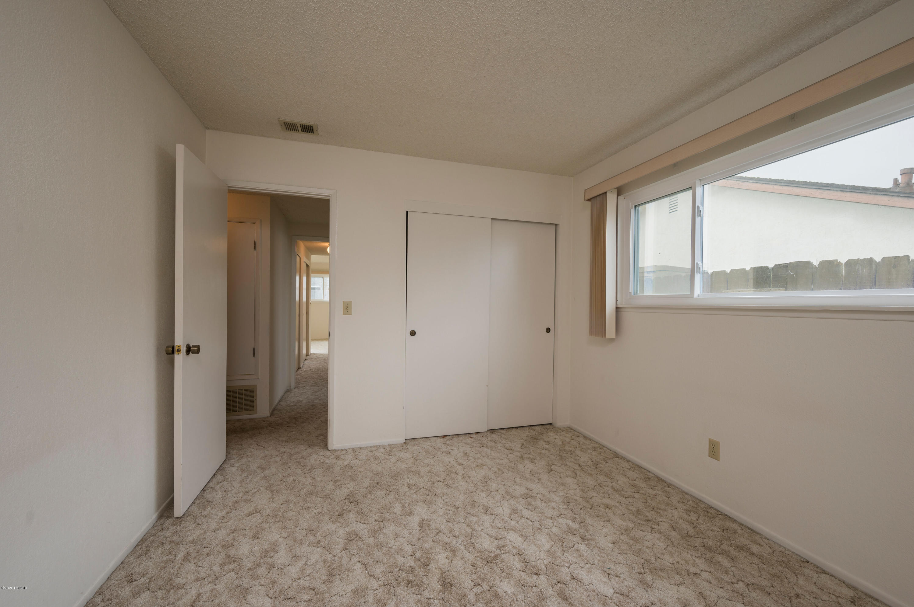 1008 West Anthony Way Lompoc, CA 93436 - Photo 21 of 26 a view of an empty room with a window